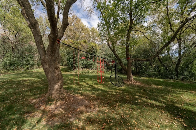 view of yard featuring a forest view