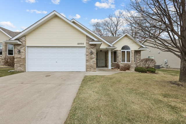 ranch-style house with a garage, concrete driveway, cooling unit, a front lawn, and brick siding