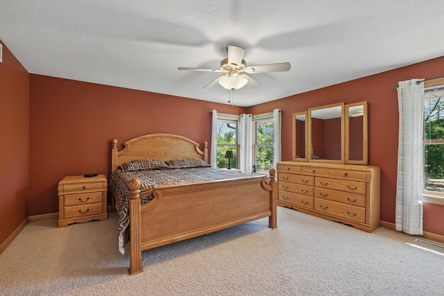 1615 Quasar Ct S, Lake Saint Croix Beach, MN 55043 - carpeted bedroom with baseboards and ceiling fan