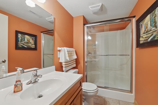 1615 Quasar Ct S, Lake Saint Croix Beach, MN 55043 - bathroom with toilet, a stall shower, vanity, and tile patterned flooring