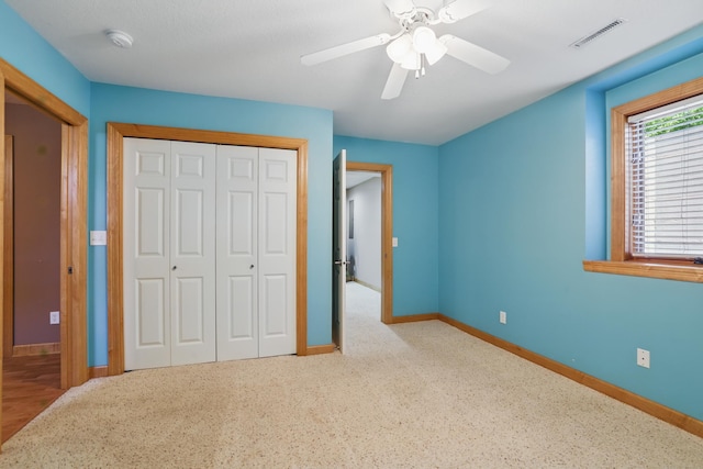 1615 Quasar Ct S, Lake Saint Croix Beach, MN 55043 - unfurnished bedroom with baseboards, a closet, and a ceiling fan