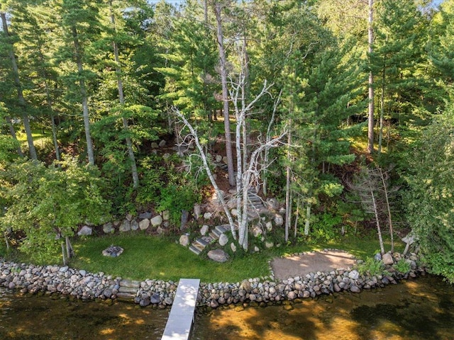 exterior space featuring a wooded view