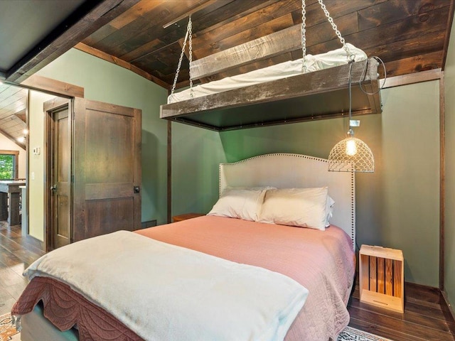 bedroom featuring vaulted ceiling with beams, wood ceiling, and wood finished floors