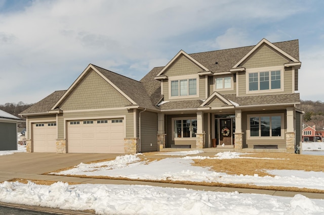 craftsman-style house with stone siding, concrete driveway, a garage, and a shingled roof