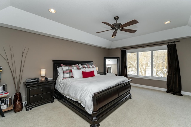 bedroom with baseboards, lofted ceiling, recessed lighting, ceiling fan, and light colored carpet