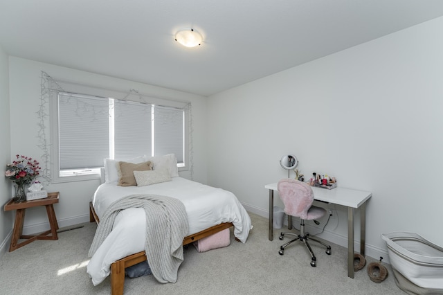 carpeted bedroom featuring baseboards