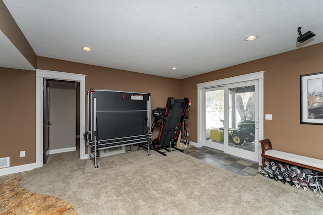 workout room featuring recessed lighting and carpet flooring