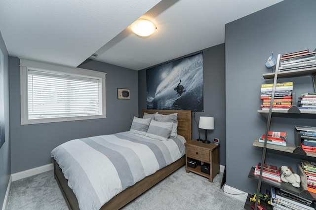 carpeted bedroom with baseboards