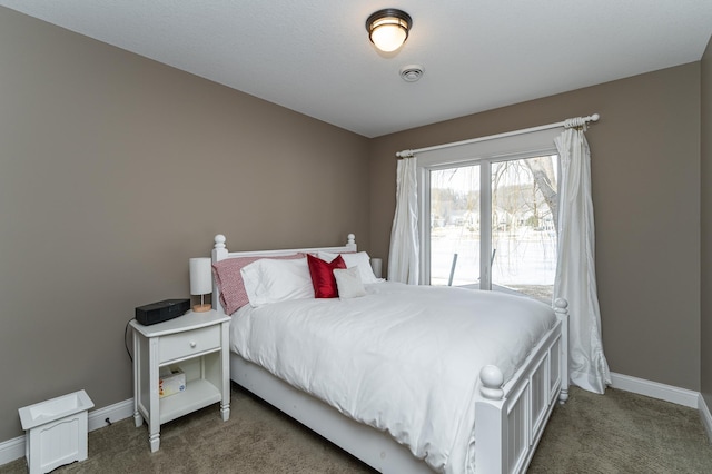 bedroom with carpet and baseboards