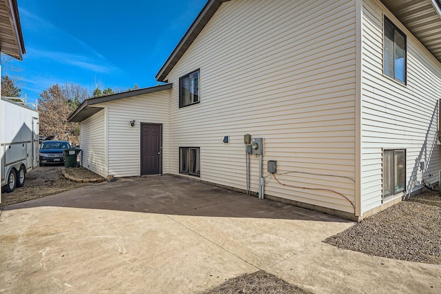 view of side of property featuring a patio