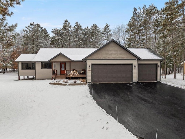 ranch-style home with driveway and an attached garage