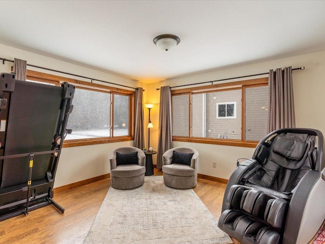 sitting room with wood finished floors and baseboards