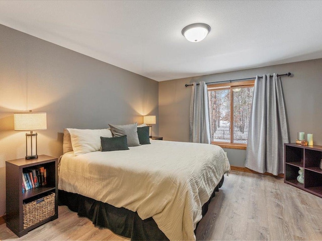 bedroom with wood finished floors