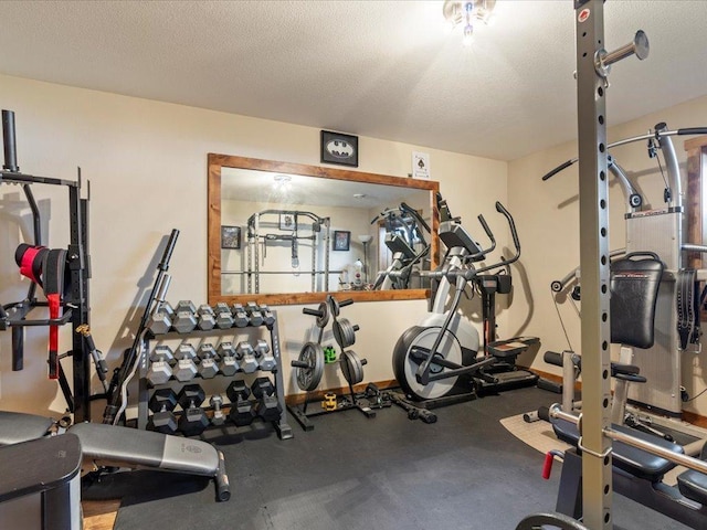 workout area with a textured ceiling