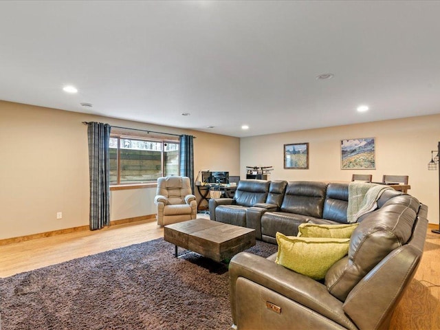 living room featuring recessed lighting, wood finished floors, and baseboards