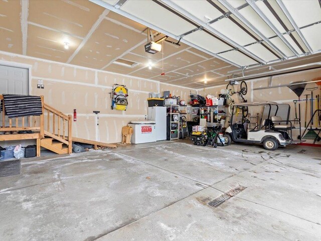 garage featuring a garage door opener