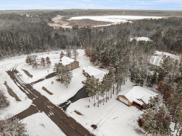 snowy aerial view with a view of trees