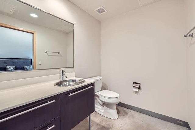 bathroom with visible vents, toilet, vanity, concrete flooring, and baseboards