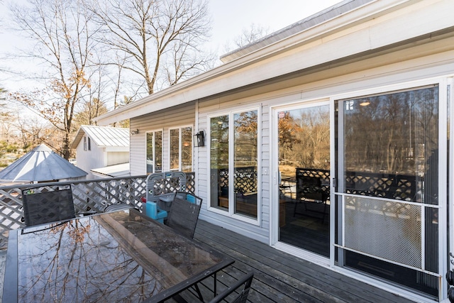 wooden deck with outdoor dining area