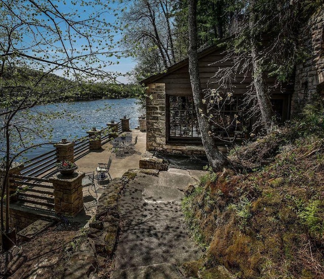 view of patio with a water view