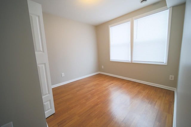 690 Western Ave N, Saint Paul, MN 55103 - spare room featuring wood finished floors and baseboards