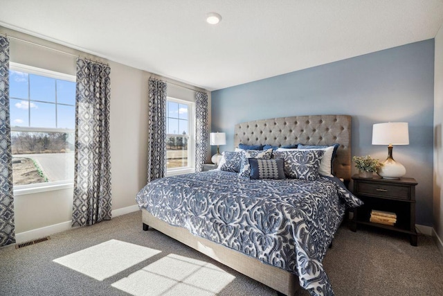 bedroom featuring carpet, visible vents, and baseboards