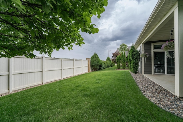 view of yard with a patio and fence