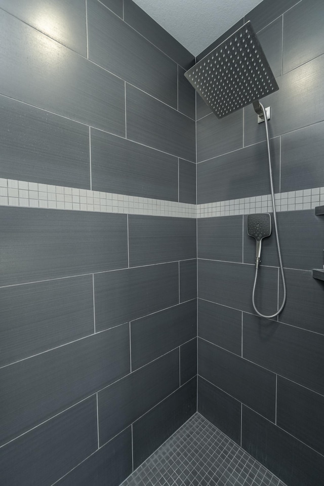 bathroom with tiled shower