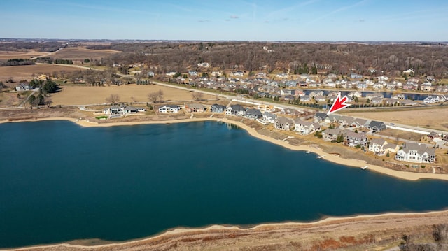 drone / aerial view with a residential view and a water view