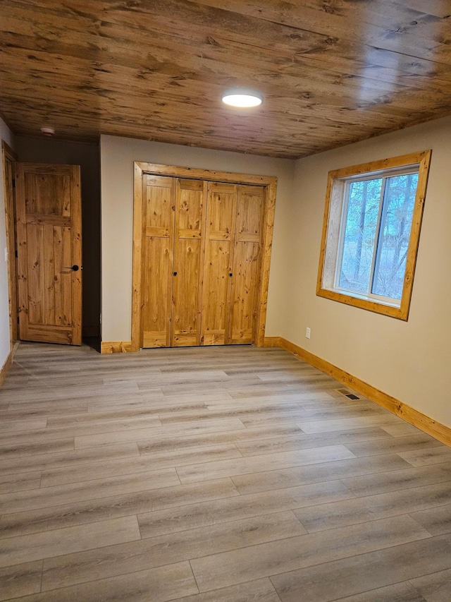 9806 County Road 144, Brainerd, MN 56401 - unfurnished bedroom with baseboards, visible vents, light wood-type flooring, and wooden ceiling