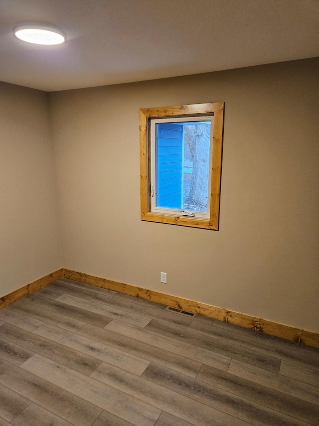 9806 County Road 144, Brainerd, MN 56401 - empty room featuring visible vents, baseboards, and wood finished floors