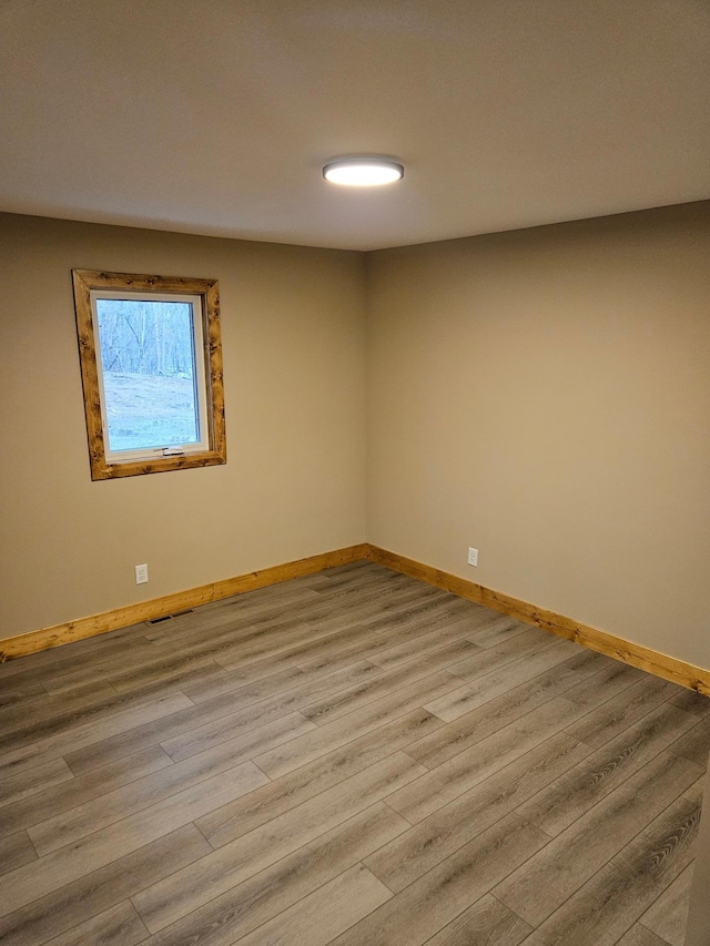 9806 County Road 144, Brainerd, MN 56401 - spare room with wood finished floors, baseboards, and visible vents