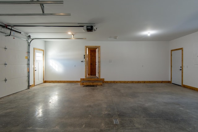 9806 County Road 144, Brainerd, MN 56401 - garage featuring baseboards and a garage door opener