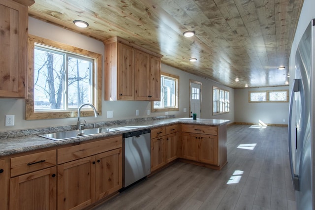 9806 County Road 144, Brainerd, MN 56401 - kitchen featuring a sink, wooden ceiling, a peninsula, and stainless steel appliances