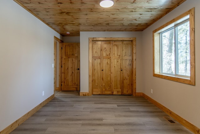 9806 County Road 144, Brainerd, MN 56401 - unfurnished bedroom with light wood finished floors, visible vents, wood ceiling, and baseboards