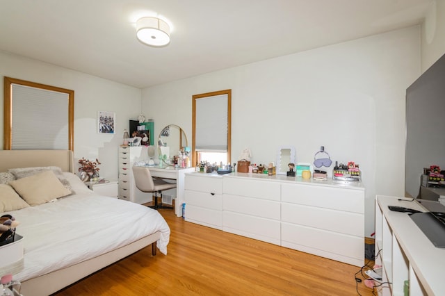 bedroom featuring light wood-style floors