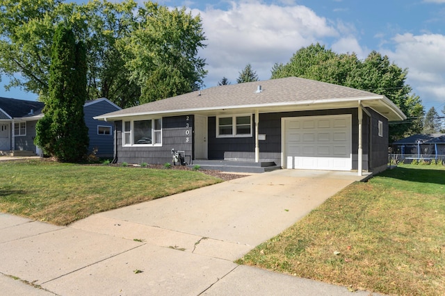 single story home with a shingled roof, a front yard, driveway, and an attached garage