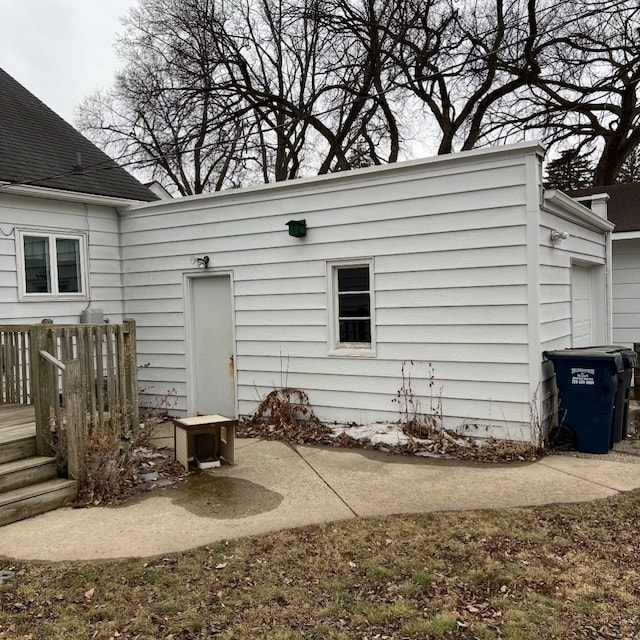 rear view of property with a wooden deck