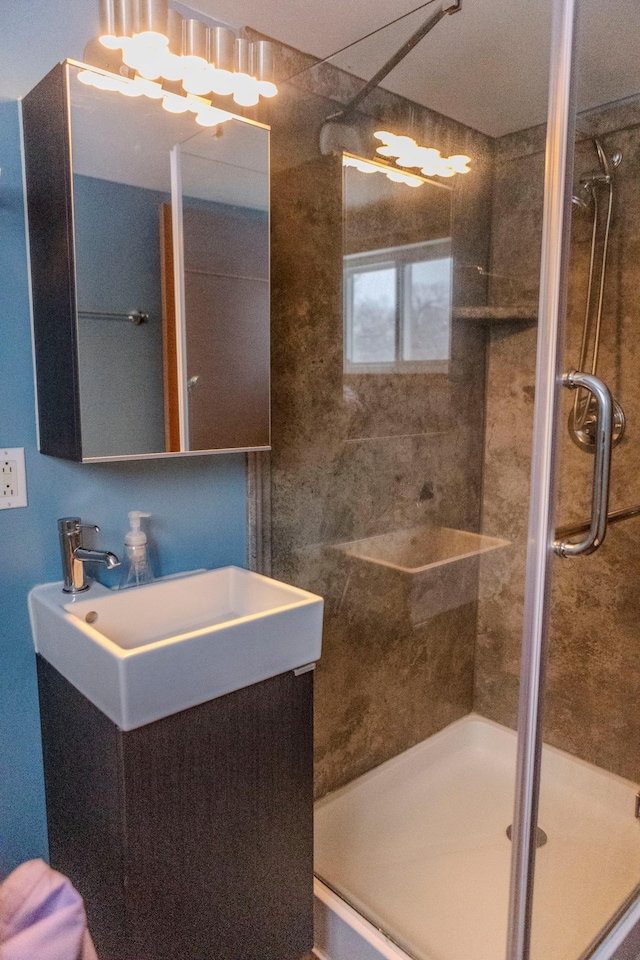 full bath featuring a stall shower and vanity