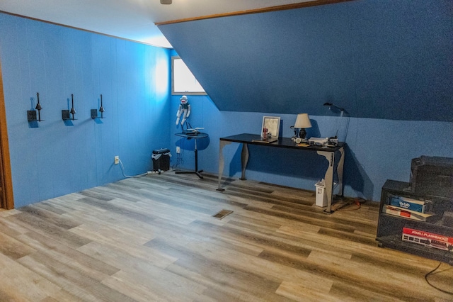 bonus room featuring vaulted ceiling, wood finished floors, and visible vents