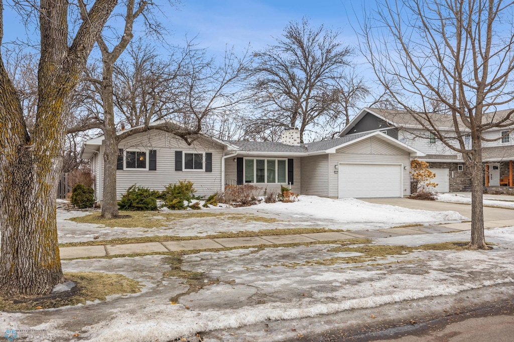 view of front of home featuring driveway and an attached garage