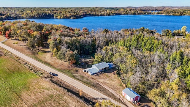 aerial view with a forest view and a water view