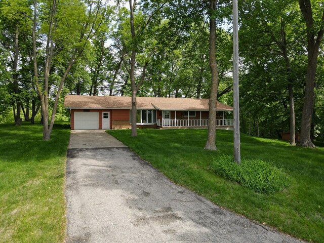 34257 Dusty Trl, Frazee, MN 56544 - ranch-style home featuring a garage, driveway, covered porch, and a front yard