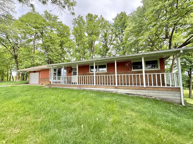 34257 Dusty Trl, Frazee, MN 56544 - single story home featuring covered porch, an attached garage, and a front yard