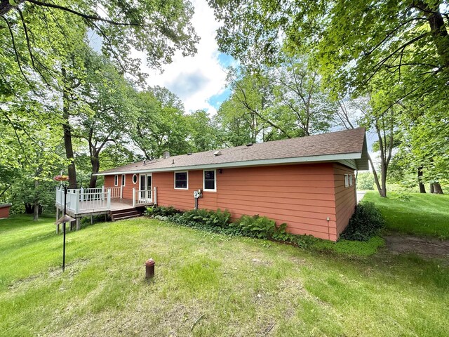 34257 Dusty Trl, Frazee, MN 56544 - back of property featuring a deck and a yard
