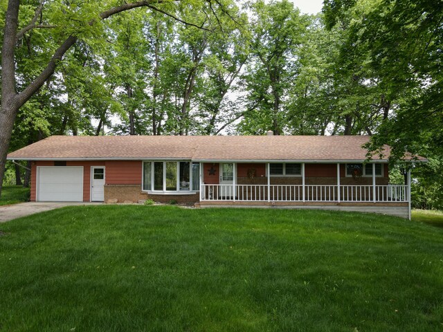 34257 Dusty Trl, Frazee, MN 56544 - single story home with an attached garage, a front lawn, concrete driveway, and covered porch