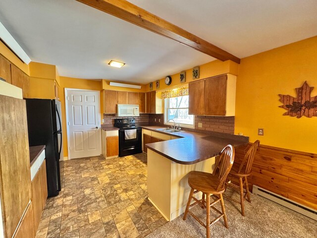 34257 Dusty Trl, Frazee, MN 56544 - kitchen with black appliances, a peninsula, baseboard heating, a sink, and backsplash