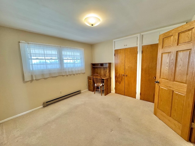 34257 Dusty Trl, Frazee, MN 56544 - carpeted bedroom with baseboard heating, multiple closets, and baseboards