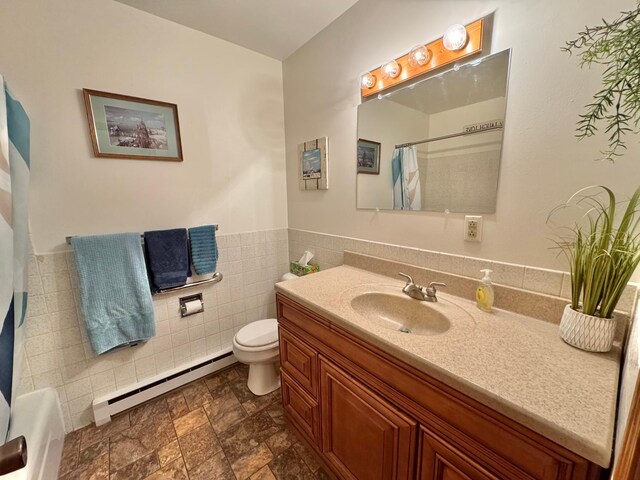 34257 Dusty Trl, Frazee, MN 56544 - bathroom with a baseboard heating unit, vanity, toilet, a shower with shower curtain, and stone finish floors