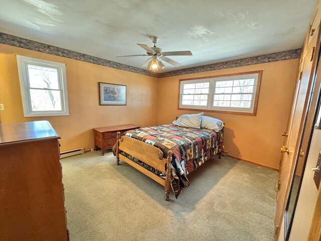 34257 Dusty Trl, Frazee, MN 56544 - bedroom with a baseboard heating unit, carpet, a ceiling fan, and baseboards